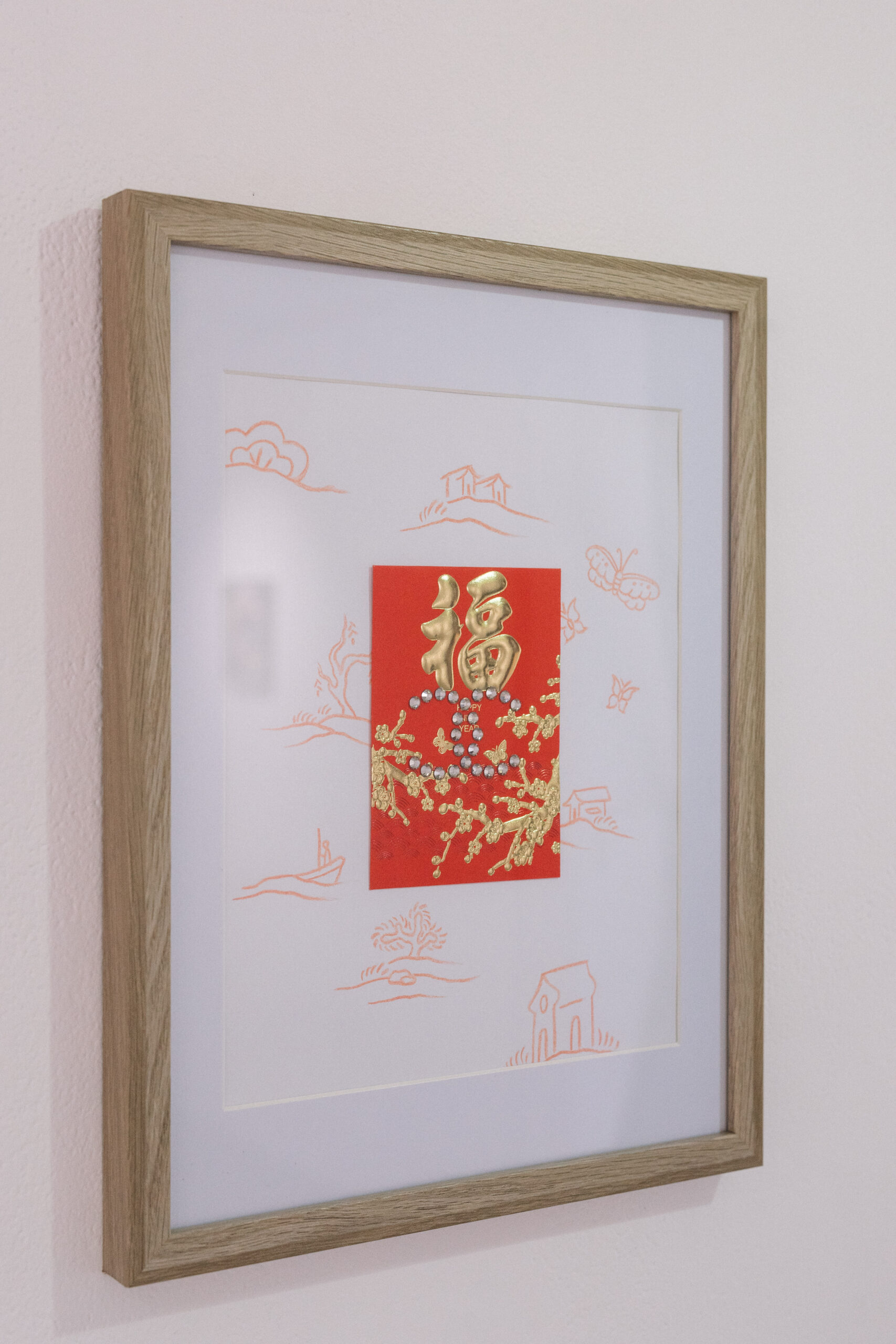 Timber framed artwork of paper with re pencil drawings, paper Hong Bao and Swarovski Crystals forming Coco Chanel Symbol.