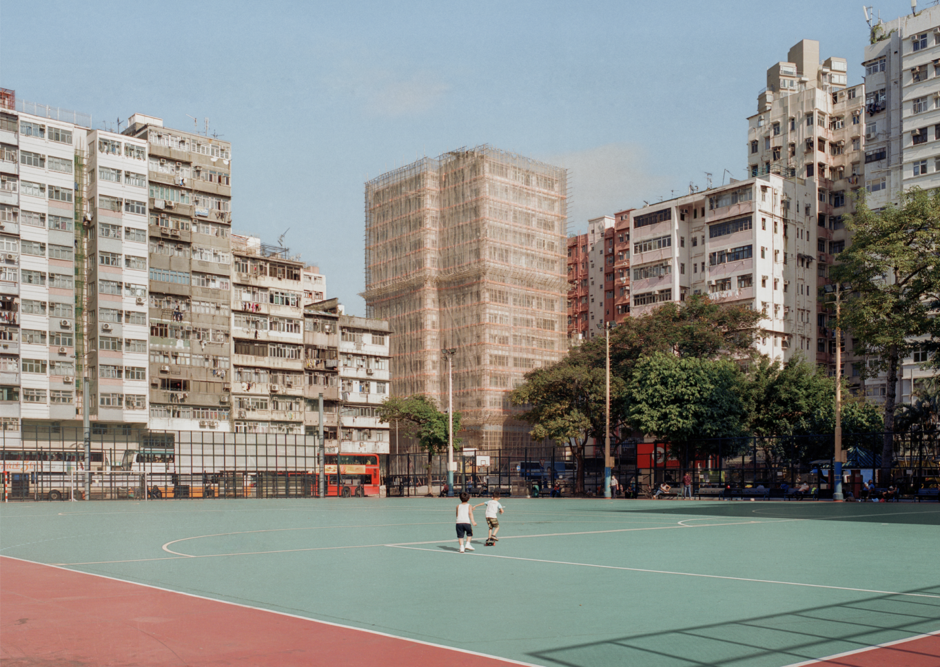 Colour photograph of a city scape and basketball court